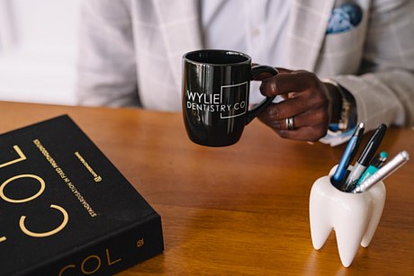 A Wylie Dentistry Co. mug on the consultation desk